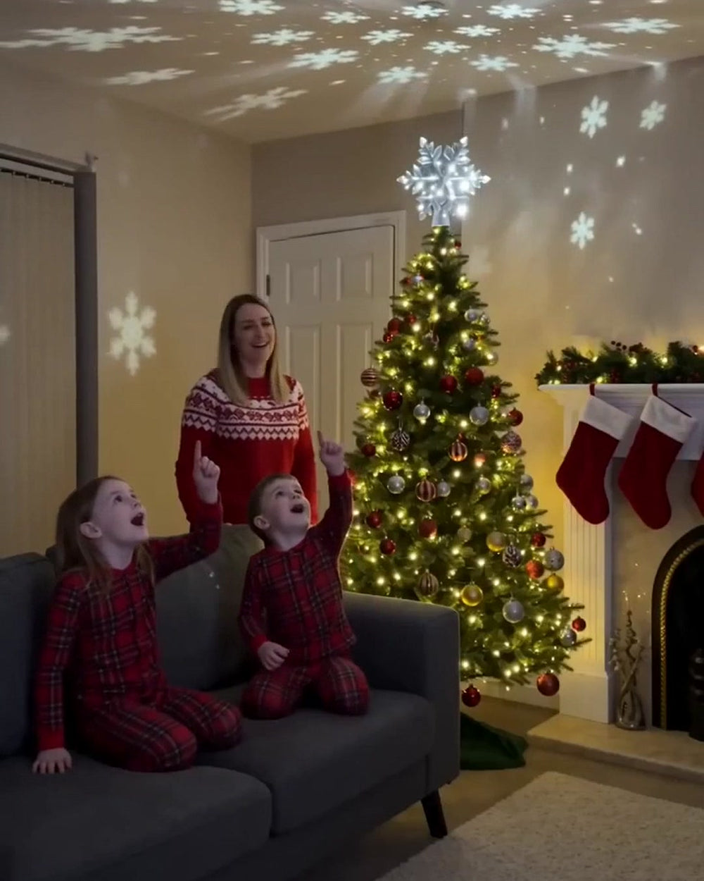 Kids watching snowflakes on the ceiling